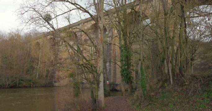The old train bridge Viaduc de Cl&eacute;cy in Normandy, France. Panning shot.