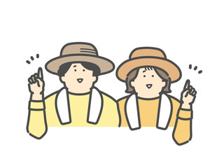 農家で働く笑顔で指差しをする若い夫婦　