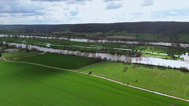 Dampierre sur Avre pond and surrounding country landscape, France. Aerial drone flyback