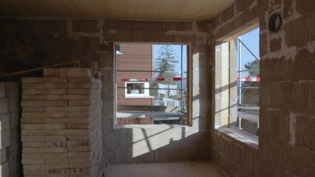 Slow approaching a window inside a hempcrete construction site