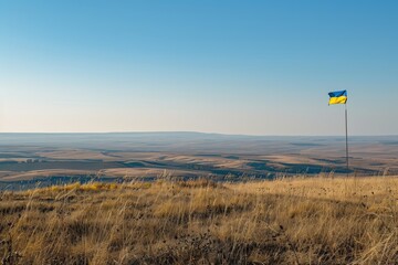 A fluttering Ukrainian flag against a clear blue sky, symbolizing national pride and unity.yellow and blue colors