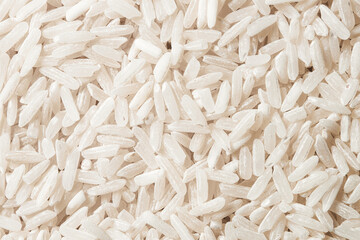 Close-up of a pile of long rice grains. Background, texture. Macro shot.