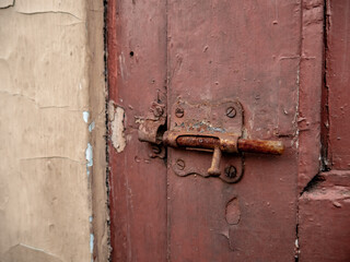 old brown door latch in the open state
