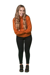 Studio portrait of a blonde Caucasian woman laughing and having fun.