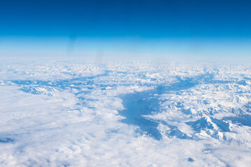 An aerial view of the Alps, a European mountain range and also the highest and most extensive...