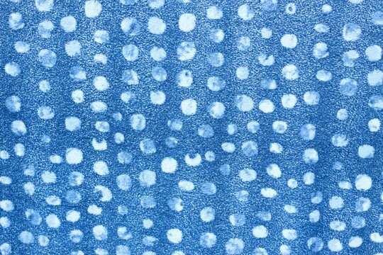 Blue flannel cloth with white dots. The background of knitted soft dotted flannel material.  ..