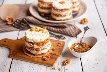 Small carrot cakes on white background
