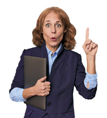 Mid-aged Caucasian with laptop in studio having some great idea, concept of creativity.