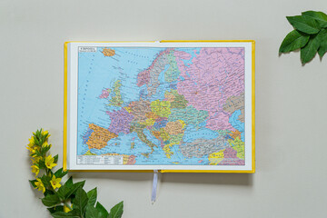 Top View of a world map. Planning a trip or adventure. Travel planning dreams. Map of Ukraine. Travel, tourism and vacation concept background. Stylish notebook, map and magnifier. Flat lay.