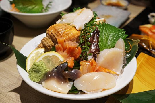 Close up assorted Sushi rolls and Sashimi- Salmon, Tuna, Shrimp, Eel, Uni, Hamachi, Egg and Octopus