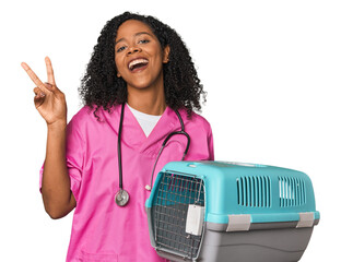 African American vet with pet carrier joyful and carefree showing a peace symbol with fingers.