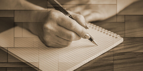 Female hand writing on notebook, geometric pattern