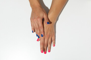 Blue and pink manicure on female hands