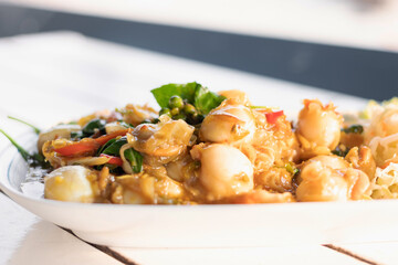 Stir fried spicy scallops with basil and chilli.
