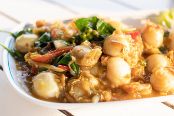 Stir fried spicy scallops with basil and chili.