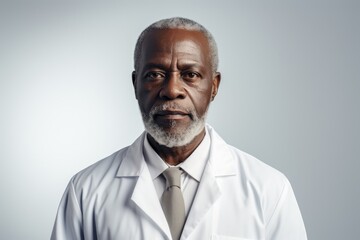 African American doctor, exuding authority and experience, poses in a lab coat, reflecting a lifetime of dedication to medicine