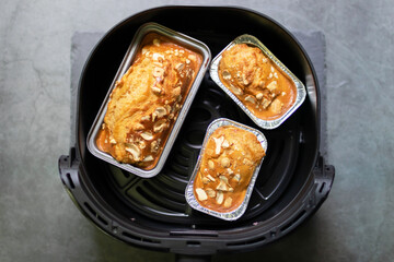 Baked peanut butter cake with nuts on cooling rack. Healthy and easy bake from air fryer.