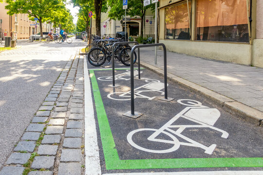 Bicycle parking symbol on road at station