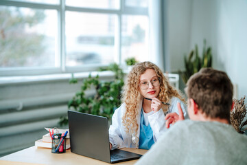 Doctor having discussion with patient in clinic