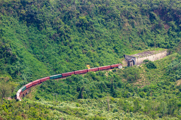 A Long Freight Train Entering Tunnel In Hai Van Pass, Vietnam.
