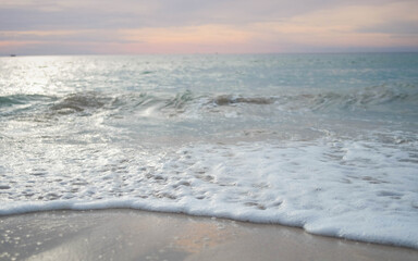 Close-up of Ocean Waves on Sandy Beach
