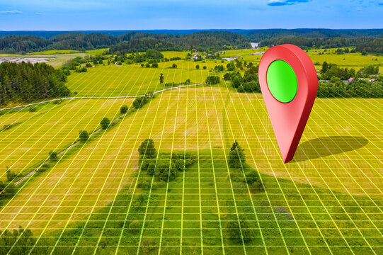 Country plot of land with Geo tag. Green meadow as seen from quadcopter. Giant geomark on territory for farm. Place to conduct agricultural business. Country plot of land with topographic lines