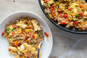 Fried rice with vegetables and scrambled eggs. Healthy vegetarian food. 