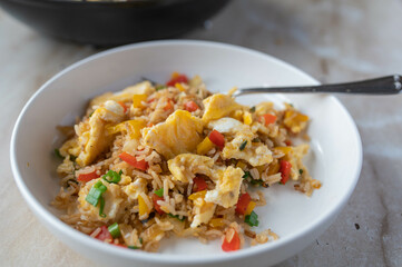 Fried rice with vegetables and scrambled eggs. Healthy vegetarian food. 