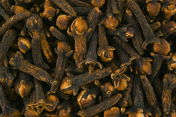 Background of spices of dried cloves. Top view.