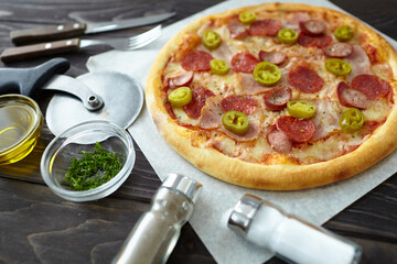 tasty pizza with ham and sauce