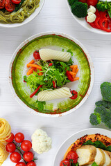 Dietary salads made from fresh vegetables, seafood and white chicken meat. Keto diet.