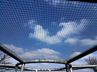 thick tubes welded into a round shape.  pergola with a net serves as a constellation for the...