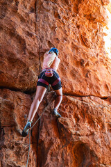 Strong woman sport climbing in the Cederberg