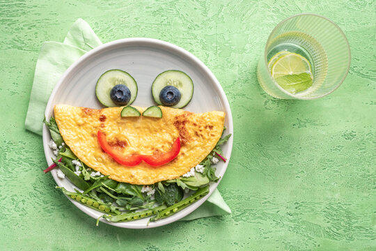 Breakfast for kids - frog omelet with vegetables