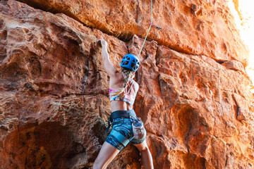 Strong woman sport climbing in the Cederberg