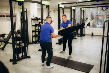 a rehabilitator works with a woman in a rehabilitation center