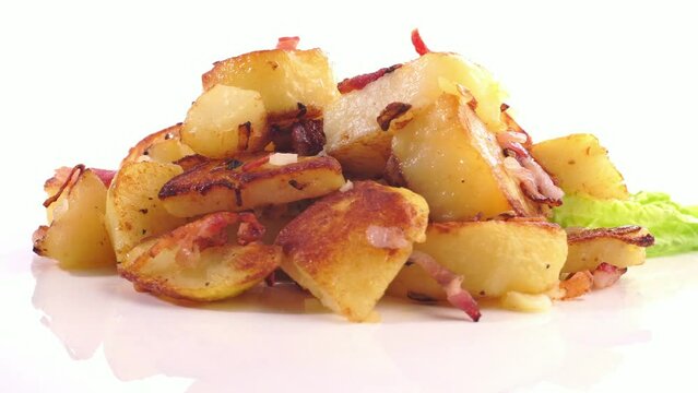 Classic Roasted Potatoes with Bacon and Onions turn around isolated on white Background