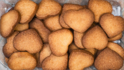 Homemade and handmade heart shaped cookies just baked, view overhead.