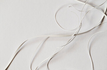 Details of scraps of cut paper strips. Still life on white background.