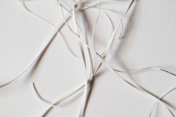 Details of scraps of cut paper strips. Still life on white background. - 761287447