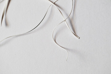 Details of scraps of cut paper strips. Still life on white background. - 761287671