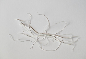 Details of scraps of cut paper strips. Still life on white background. - 761287872