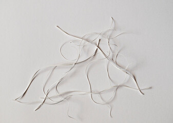 Details of scraps of cut paper strips. Still life on white background.