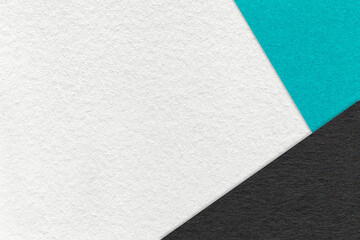 Fototapeta premium Texture of craft white color paper background with black and turquoise border. Vintage abstract cerulean cardboard.