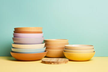 Colorful Stacked Ceramic Bowls on Two-Tone Background