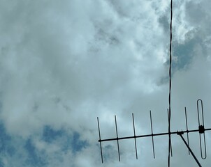An old TV antenna under the sky