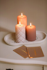 Astrology. Burning candles near astrologer cards. Tarot cards. Esoteric background.  Tarot predictions