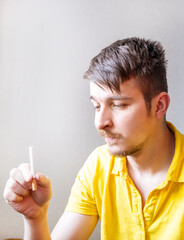 Sad Young Man with a Cigarette - 761299210