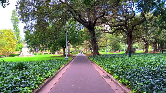 Monday 18 March 2024 Hyde Park Sydney in afternoon is in the heart of the CBD. trees flowers and pedestrians Sydney NSW Australia