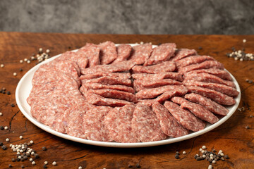 Meatballs made from raw beef mince. Butcher products. Uncooked meatballs on a dark background